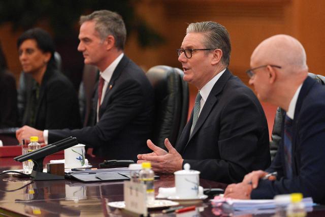 Britain's Prime Minister Keir Starmer (C) speaks during a meeting with China's President Xi Jinping at the Great Hall of the People in Beijing on January 29, 2026. China's President Xi Jinping told Britain's Prime Minister Keir Starmer their countries must "strengthen" ties to counter geopolitical headwinds, as the leaders met in Beijing on January 29. (Photo by Carl Court / POOL / AFP)