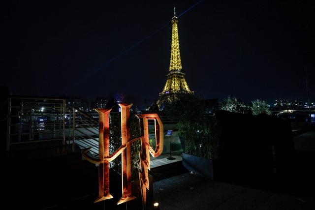 This photograph shows the logo of the Harry Potter in front of the Eiffel Tower to celebrate the 25th anniversary of the Harry Potter movie franchise, in Paris on January 28, 2026. (Photo by STEPHANE DE SAKUTIN / AFP)