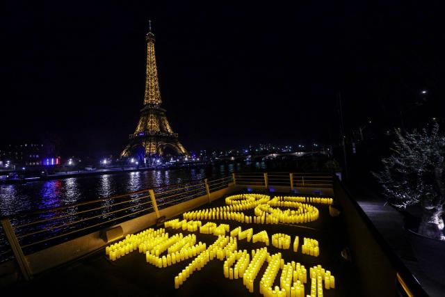 This photograph shows a celebration of the 25th anniversary of the Harry Potter movie franchise in front of the Eiffel Tower, in Paris on January 28, 2026. (Photo by STEPHANE DE SAKUTIN / AFP)