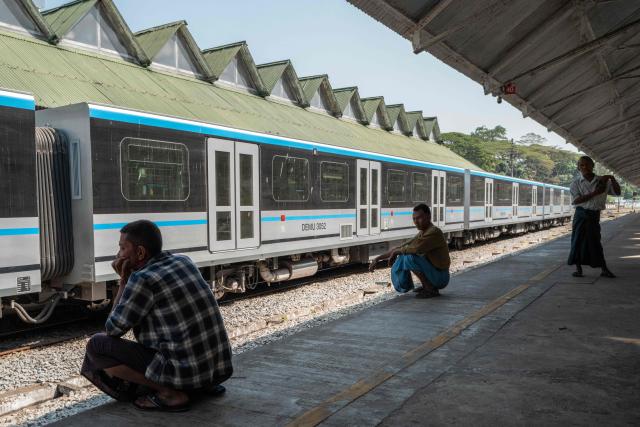 Commuters wait for the Circular Train at Yangon Central Station in Yangon on January 28, 2026. Yangon’s Circular Railway is a 45.9 km commuter rail loop with 39 stations that connects the city center to its suburbs. Built by the British in the 1930’s, it remains one of the cheapest and most used transport options for local commuters, with a complete circuit taking about three hours to travel. (Photo by ANTHONY WALLACE / AFP)