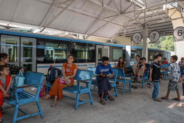 Commuters wait for the Circular Railway train at Yangon Central Station in Yangon on January 28, 2026. Yangon’s Circular Railway is a 45.9 km commuter rail loop with 39 stations that connects the city center to its suburbs. Built by the British in the 1930’s, it remains one of the cheapest and most used transport options for local commuters, with a complete circuit taking about three hours to travel. (Photo by ANTHONY WALLACE / AFP)