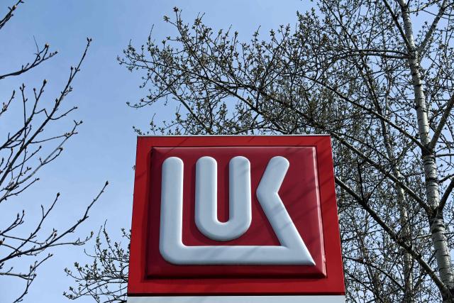 (FILES) The logo of Russia's oil company Lukoil is pictured at one of its petrol stations in Moscow on April 16, 2021. Russia's oil giant Lukoil, sanctioned by Washington over the Ukraine war, said on January 29, 2026 that it will sell its foreign assets to the US investment firm The Carlyle Group. (Photo by Kirill KUDRYAVTSEV / AFP)