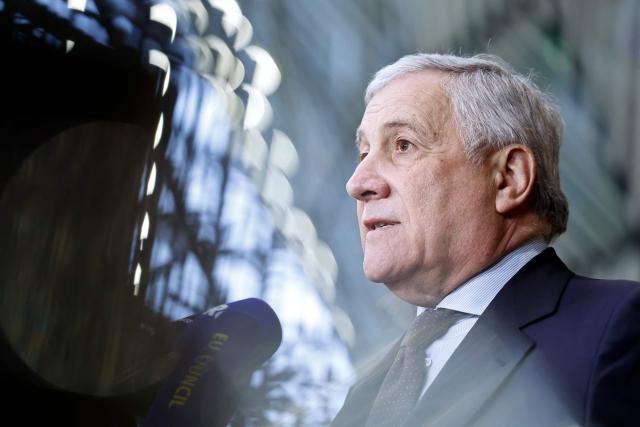Italy's Foreign Minister Antonio Tajani talks to journalists upon arrival ahead of a EU Foreign Affairs Council meeting at the EU headquarters in Brussels on January 29, 2026. The Council is expected to discuss the latest developments in Russia’s invasion in Ukraine with discussions focusing on peace negotiations, support for Ukraine and pressure on Russia. (Photo by SIMON WOHLFAHRT / AFP)