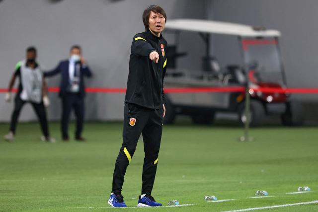 (FILES) China's coach Li Tie speaks to his players during the 2022 Qatar football World Cup Asian Qualifiers match between China and Japan, at the Khalifa International stadium in Doha, on September 7, 2021. China's football association issued lifetime bans to 73 people, including former national team head coach Li Tie, and punished 13 top professional clubs for match-fixing and corruption, it said on January 29, 2026. (Photo by KARIM JAAFAR / AFP)