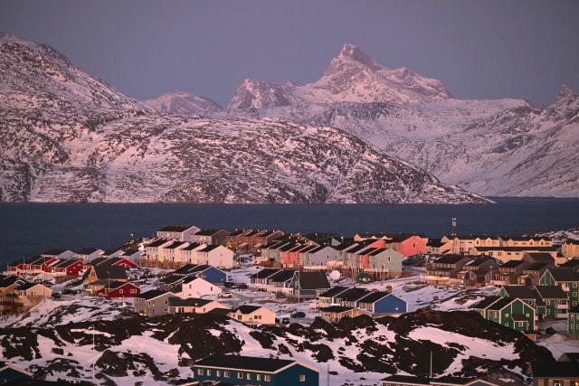 A photo shows a residential area near the airport at the city of Nuuk, western Greenland, with a slightly snow covered mountain in the background, on January 28, 2026. (Photo by Ina FASSBENDER / AFP)
