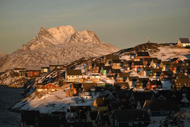 A photo shows the old city of Nuuk, western Greenland, with a slightly snow covered mountain in the background, on January 28, 2026. (Photo by Ina FASSBENDER / AFP)