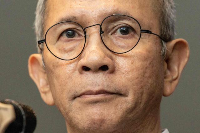 Mahendra Siregar, Chairman of the Board of Commissioners of the Indonesian Financial Services Authority (OJK), speaks to the media at the Indonesia Stock Exchange (IDX) in Jakarta on January 29, 2026. (Photo by YASUYOSHI CHIBA / AFP)