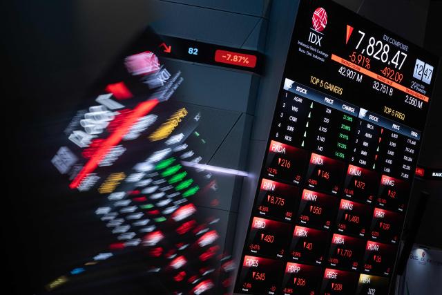 An electronic board displays stock prices at the Indonesia Stock Exchange (IDX) in Jakarta on January 29, 2026. (Photo by YASUYOSHI CHIBA / AFP)