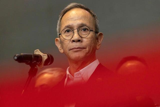Mahendra Siregar, Chairman of the Board of Commissioners of the Indonesian Financial Services Authority (OJK), speaks to the media at the Indonesia Stock Exchange (IDX) in Jakarta on January 29, 2026. (Photo by YASUYOSHI CHIBA / AFP)