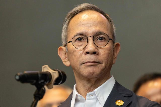 Mahendra Siregar, Chairman of the Board of Commissioners of the Indonesian Financial Services Authority (OJK), speaks to the media at the Indonesia Stock Exchange (IDX) in Jakarta on January 29, 2026. (Photo by YASUYOSHI CHIBA / AFP)