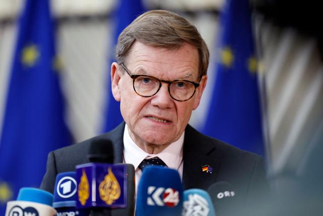 Germany's Foreign Minister Johann Wadephul talks to journalists as he arrives for a EU Foreign Affairs Council meeting at the EU headquarters in Brussels on January 29, 2026. The Council is expected to discuss the latest developments in Ukraine with discussions focused on peace negotiations, support for Ukraine and pressure on Russia. (Photo by SIMON WOHLFAHRT / AFP)