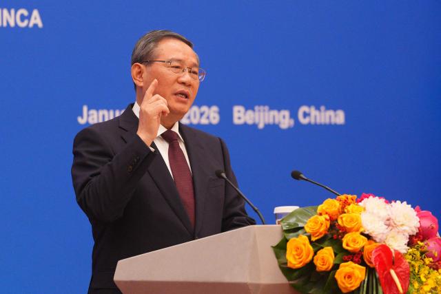 Chinese Premier Li Qiang speaks during the 2026 UK-China Business Council with Britain's Prime Minister Keir Starmer (not pictured) held at the Great Hall of the People in Beijing on January 29, 2026. Chinese President Xi Jinping told Starmer their countries must "strengthen" ties to counter geopolitical headwinds, as the leaders met in Beijing on January 29. (Photo by Carl Court / POOL / AFP)