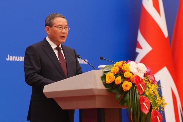 Chinese Premier Li Qiang speaks during the 2026 UK-China Business Council with Britain's Prime Minister Keir Starmer (not pictured) held at the Great Hall of the People in Beijing on January 29, 2026. Chinese President Xi Jinping told Starmer their countries must "strengthen" ties to counter geopolitical headwinds, as the leaders met in Beijing on January 29. (Photo by Carl Court / POOL / AFP)