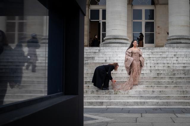 French internet personality Lena Situations has her dressed arranged prior to pose for pictures upon arrival at the Palais Brongniart to attend the Ashi Studio Women's Haute Couture Spring/Summer 2026 collection fashion show as part of the Paris Haute Couture Fashion Week, in Paris, on January 29, 2026. (Photo by Guillaume BAPTISTE / AFP)