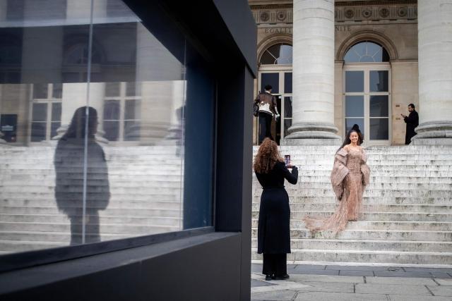 French internet personality Lena Situations arrives at the Palais Brongniart to attend the Ashi Studio Women's Haute Couture Spring/Summer 2026 collection fashion show as part of the Paris Haute Couture Fashion Week, in Paris, on January 29, 2026. (Photo by Guillaume BAPTISTE / AFP)
