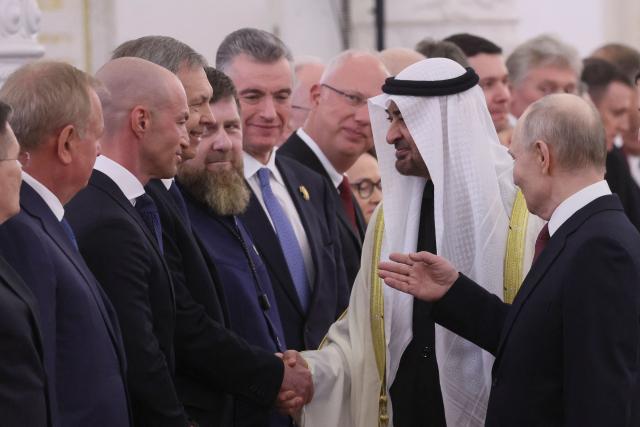 Russian President Vladimir Putin introduces Russian officials to UAE President Sheikh Mohamed bin Zayed al-Nahyan during their meeting at the Kremlin in Moscow on January 29, 2026. (Photo by MAXIM SHIPENKOV / POOL / AFP)