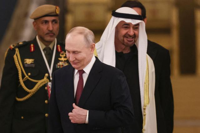Russian President Vladimir Putin and UAE President Sheikh Mohamed bin Zayed al-Nahyan enter a hall during their meeting at the Kremlin in Moscow on January 29, 2026. (Photo by MAXIM SHIPENKOV / POOL / AFP)