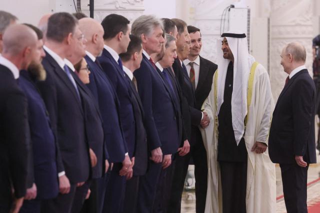 UAE President Sheikh Mohamed bin Zayed al-Nahyan, flanked by Russian President Vladimir Putin, greets Russian Foreign Minister Sergei Lavrov during their meeting at the Kremlin in Moscow on January 29, 2026. (Photo by MAXIM SHIPENKOV / POOL / AFP)