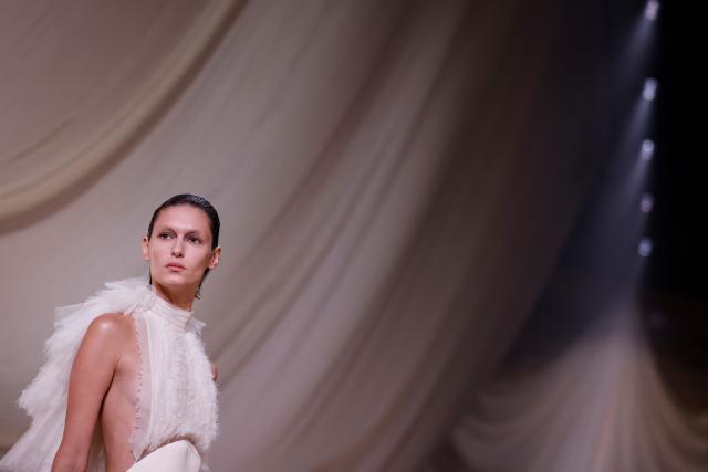 A model presents a creation for Ashi Studio for the Women's Haute Couture Spring/Summer 2026 collection fashion show as part of the Paris Haute Couture Fashion Week, in Paris, on January 29, 2026. (Photo by Ian LANGSDON / AFP)