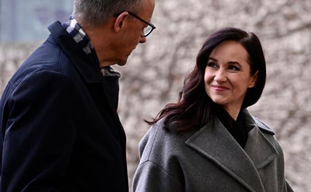 German Chancellor Friedrich Merz (L) welcomes Lithuania's Prime Minister Inga Ruginiene as she arrives for a visit at the Chancellery in Berlin, Germany, on January 29, 2026. (Photo by Tobias SCHWARZ / AFP)