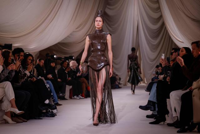 A model presents a creation for Ashi Studio for the Women's Haute Couture Spring/Summer 2026 collection fashion show as part of the Paris Haute Couture Fashion Week, in Paris, on January 29, 2026. (Photo by Ian LANGSDON / AFP)