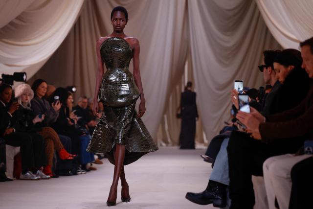 A model presents a creation for Ashi Studio for the Women's Haute Couture Spring/Summer 2026 collection fashion show as part of the Paris Haute Couture Fashion Week, in Paris, on January 29, 2026. (Photo by Ian LANGSDON / AFP)