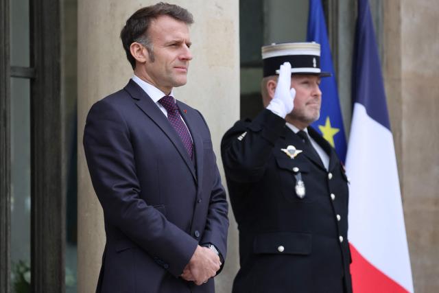 France's President Emmanuel Macron reacts as he awaits Slovakia's Prime Minister prior to a working lunch at the Elysee presidential Palace in Paris, on January 29, 2026. (Photo by Ludovic MARIN / AFP)