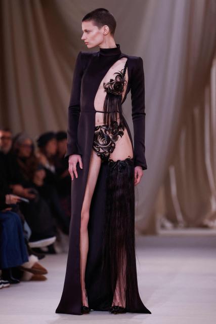 EDITORS NOTE: Graphic content / A model presents a creation for Ashi Studio for the Women's Haute Couture Spring/Summer 2026 collection fashion show as part of the Paris Haute Couture Fashion Week, in Paris, on January 29, 2026. (Photo by Ian LANGSDON / AFP)