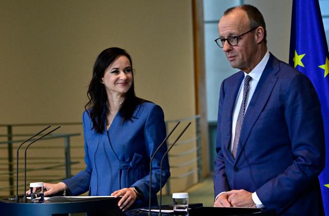 Lithuania's Prime Minister Inga Ruginiene and German Chancellor Friedrich Merz address a joint press conference at the Chancellery in Berlin, Germany, on January 29, 2026. (Photo by Tobias SCHWARZ / AFP)