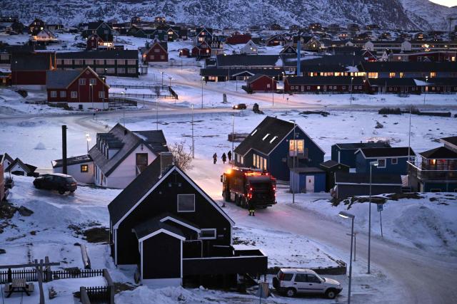 A truck is seen in a street as garbage is being collected in a residential area of Nuuk, Greenland, on January 29, 2026. (Photo by Ina FASSBENDER / AFP)