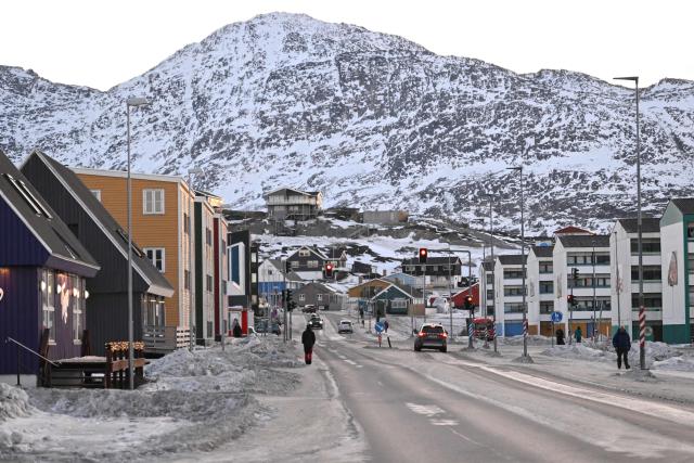 A man walks in a street in Nuuk, Greenland, on January 29, 2026. (Photo by Ina FASSBENDER / AFP)