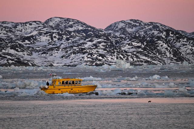 A Nuuk Water Taxi navigates off the coastline of Nuuk, Greenland, on January 29, 2026. (Photo by Ina FASSBENDER / AFP)