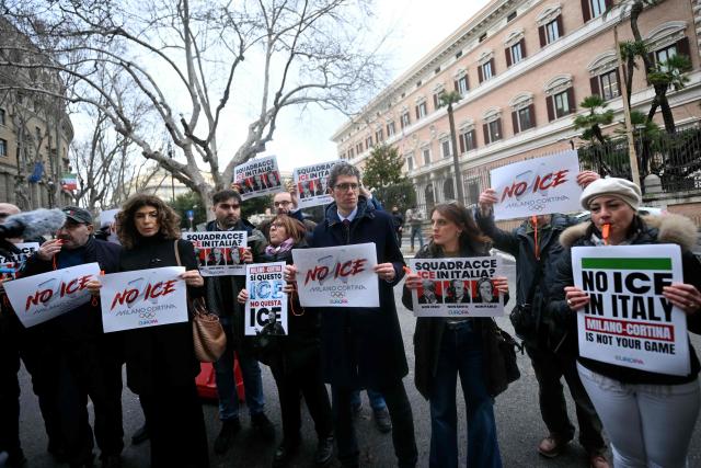 More Europe secretary Riccardo Magi (C) attends a flash mob to protest against US Immigration and Customs Enforcement (ICE), in front of US embassy in Rome on January 29, 2026. A branch of the US Immigration and Customs Enforcement (ICE) will help support security operations for the Winter Olympics in Italy, sparking consternation and warnings they were not welcome. (Photo by Filippo MONTEFORTE / AFP)