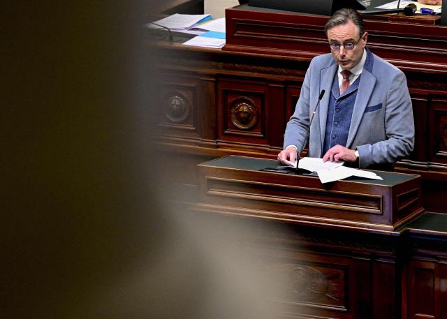 Belgium's Prime Minister Bart De Wever delivers a speech during a plenary session of the Chamber at the Federal Parliament in Brussels on January 29, 2026. (Photo by DIRK WAEM / Belga / AFP) / Belgium OUT