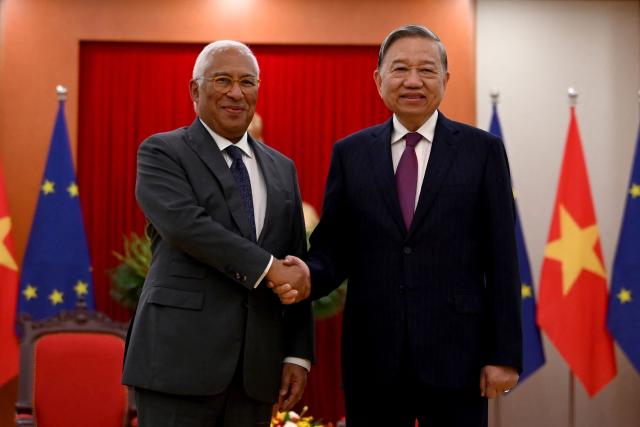 General Secretary of the Communist Party of Vietnam To Lam (R) shakes hands with European Council President Antonio Costa during a meeting at the party's central office in Hanoi on January 29, 2026. (Photo by Nhac NGUYEN / POOL / AFP)