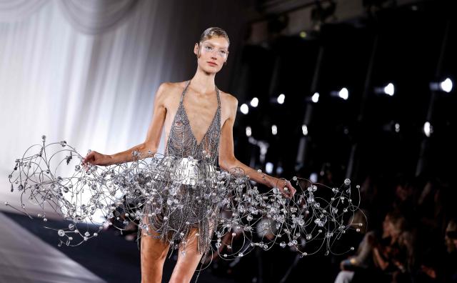 A model presents a creation by Celia Kritharioti for the Women's Haute Couture Spring/Summer 2026 collection fashion show as part of the Paris Haute Couture Fashion Week, in Paris, on January 29, 2026. (Photo by Ian LANGSDON / AFP)
