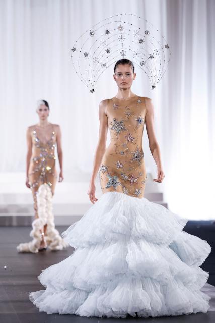 A model presents a creation by Celia Kritharioti for the Women's Haute Couture Spring/Summer 2026 collection fashion show as part of the Paris Haute Couture Fashion Week, in Paris, on January 29, 2026. (Photo by Ian LANGSDON / AFP)