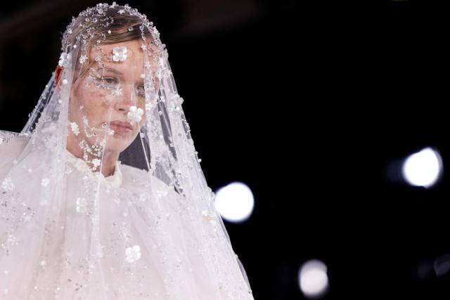 A model presents a creation by Celia Kritharioti for the Women's Haute Couture Spring/Summer 2026 collection fashion show as part of the Paris Haute Couture Fashion Week, in Paris, on January 29, 2026. (Photo by Ian LANGSDON / AFP)