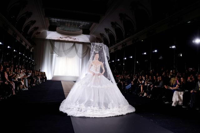 A model presents a creation by Celia Kritharioti for the Women's Haute Couture Spring/Summer 2026 collection fashion show at the Pavillon Cambon as part of the Paris Haute Couture Fashion Week, in Paris, on January 29, 2026. (Photo by Ian LANGSDON / AFP)