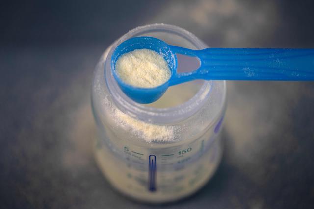 This photograph shows a spoonfull of infant milk formula in Quimper, western France January 29, 2026. The infant formula affair, already the subject of two investigations opened in France after the deaths of two infants, enters a new legal phase on January 29, 2026 with a complaint filed in Paris by the association Foodwatch and eight families, who accuse the industry and the government of failing to act in time. (Photo by Fred TANNEAU / AFP)