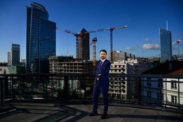 Mayor of Lyon and candidate for re-election in France's upcoming local elections Gregory Doucet poses on the rooftop of a building in the Part-Dieu district in Lyon, central eastern France on January 29, 2026. (Photo by OLIVIER CHASSIGNOLE / AFP)