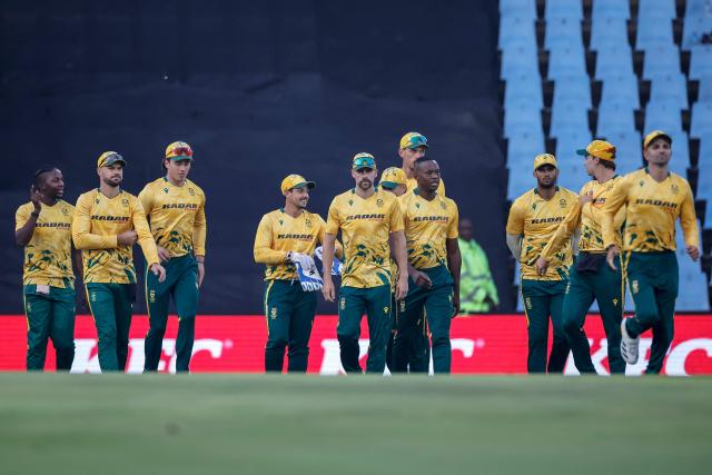 South African players walk onto the field during the second Twenty20 international cricket match between South Africa and West Indies at SuperSport Park in Centurion on January 29, 2026. (Photo by PHILL MAGAKOE / AFP)