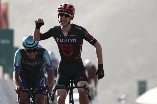 Tudor Pro Cycling Team's Swiss rider Yannis Voisard celebrates as he crosses the finish line to win the third stage of the AlUla Tour cycling race, 142.1km from Winter Park to Bir Jaydah Mountain Wirkah on January 29, 2026. (Photo by Anne-Christine POUJOULAT / AFP)