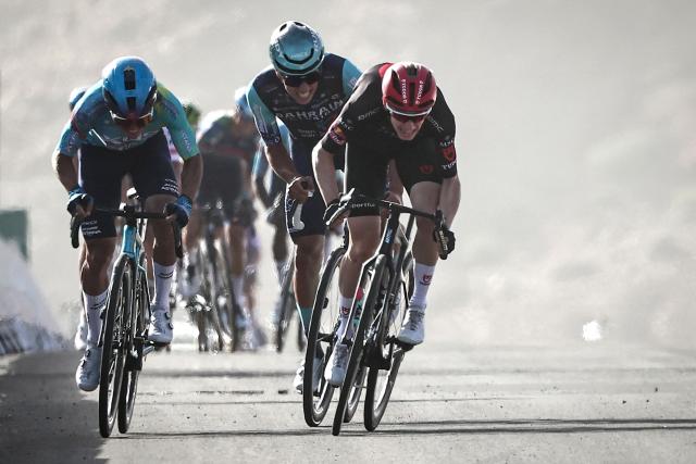 Tudor Pro Cycling team Switzerland's Yannis Voisard (R) sprints to the finish line to win the third stage of the AlUla Tour cycling race, 142.1km from Winter Park to Bir Jaydah Mountain Wirkah on January 29, 2026. (Photo by Anne-Christine POUJOULAT / AFP)