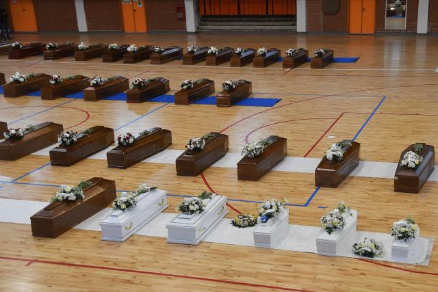 (FILES) A photograph taken on February 28, 2023 shows the coffins of migrants who died two days day before, after their boat sank off Italy's southern Calabria region, at the Crotone Palasport, converted to a temporary funeral home for the victims, in Steccato di Cutro, south of Crotone. Six members of Italy's police and coastguard go on trial on January 30, 2026 over a 2023 shipwreck that killed at least 94 migrants, accused of failing to intervene before it was too late. (Photo by Alessandro SERRANO / AFP)
