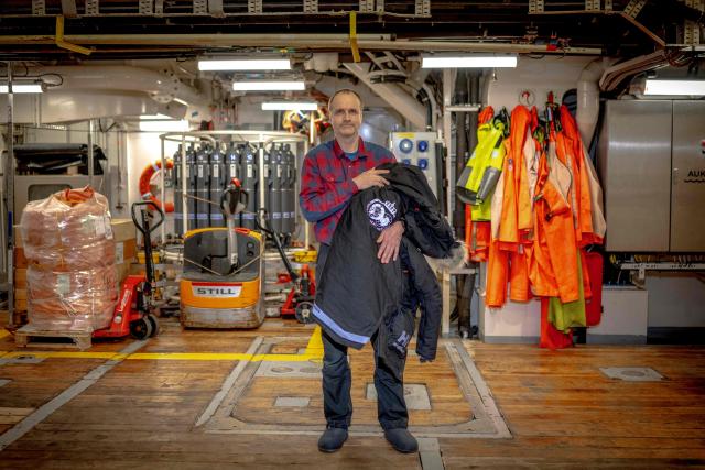 Norwegian Chief of  Polar bear mission Jon Aars poses in the Scientific Ice going vessel "Kronprins Haakon" in eastern Spitzbergen, in the Svalbard archipelago, on April 10, 2025. The Norwegian Polar Institute, an Arctic research organisation, organised a five-week expedition aboard the high-tech research vessel and icebreaker Kronprins Haakon to collect adipose tissue biopsies and blood samples from polar bears in order to study the impact of pollutants on their health. (Photo by Olivier MORIN / AFP)