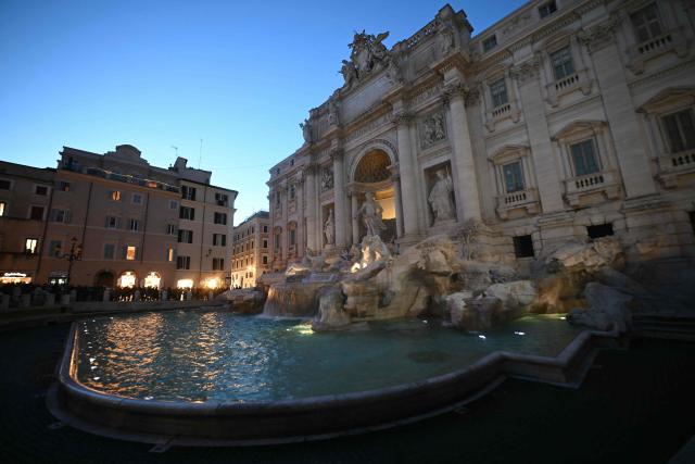 A picture shows the Trevi Fountain at night, in Rome on January 29, 2026. (Photo by Filippo MONTEFORTE / AFP)