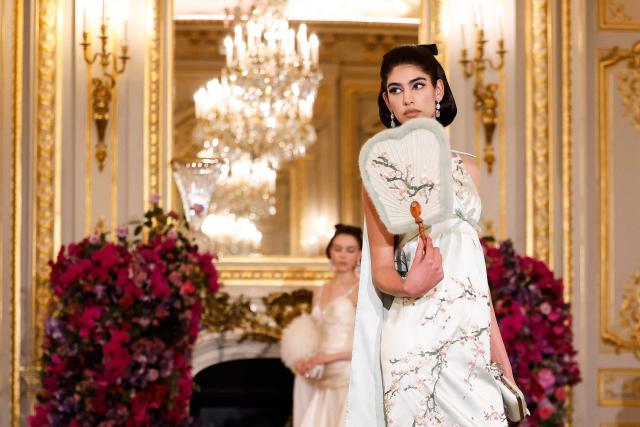 A model presents a creation for Miss Sohee for the Women's Haute Couture Spring/Summer 2026 collection fashion show as part of the Paris Haute Couture Fashion Week, in Paris, on January 29, 2026. (Photo by Ian LANGSDON / AFP)
