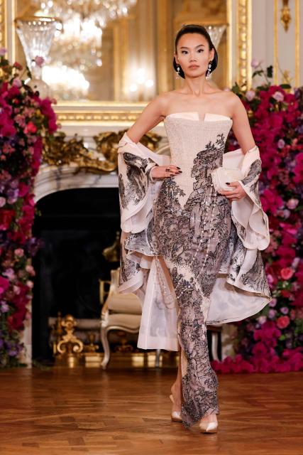 A model presents a creation for Miss Sohee for the Women's Haute Couture Spring/Summer 2026 collection fashion show as part of the Paris Haute Couture Fashion Week, in Paris, on January 29, 2026. (Photo by Ian LANGSDON / AFP)