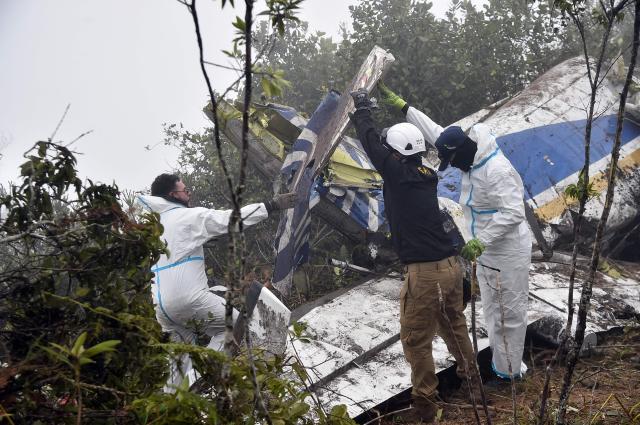 Search and rescue personnel carry the wreckage of a plane that crashed, killing 15 people, in La Playa de Belen municipality, Norte de Santander department, Colombia, on January 29, 2026. A twin-propeller aircraft carrying 15 people, including a Colombian lawmaker, crashed in a mountainous region near the Venezuelan border on January 28, killing all passengers and crew, according to authorities in Bogota. The plane took off from the Colombian border city of Cucuta and lost contact with air traffic control shortly before it was due to land in nearby Ocana around noon. (Photo by Schneyder Mendoza / AFP)